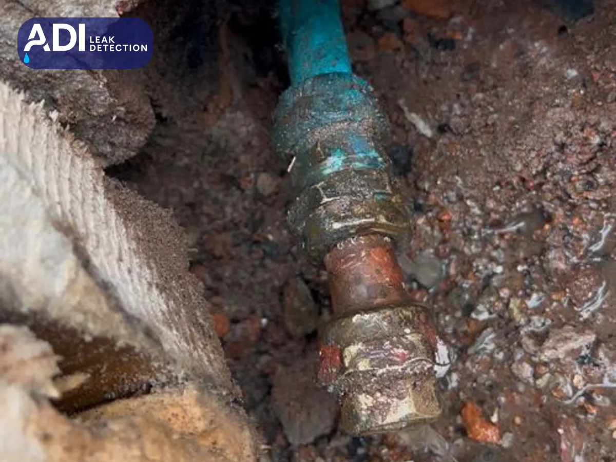 Corroded fitting on the pipe inside the wall opening